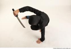 Man Young Athletic Fighting with knife Kneeling poses Casual Asian